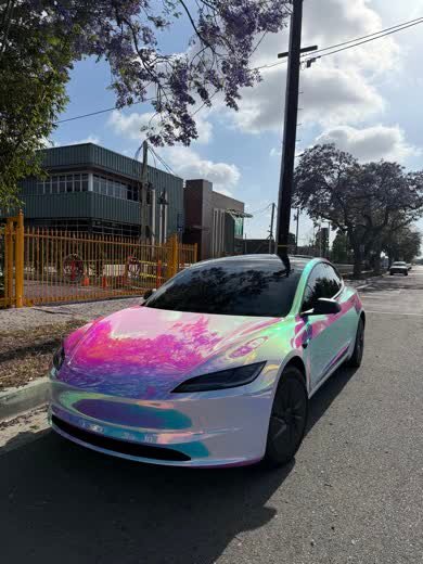 Tesla Model 3 wrapped in purple-blue-aquamarine neochrome colour-shift film
