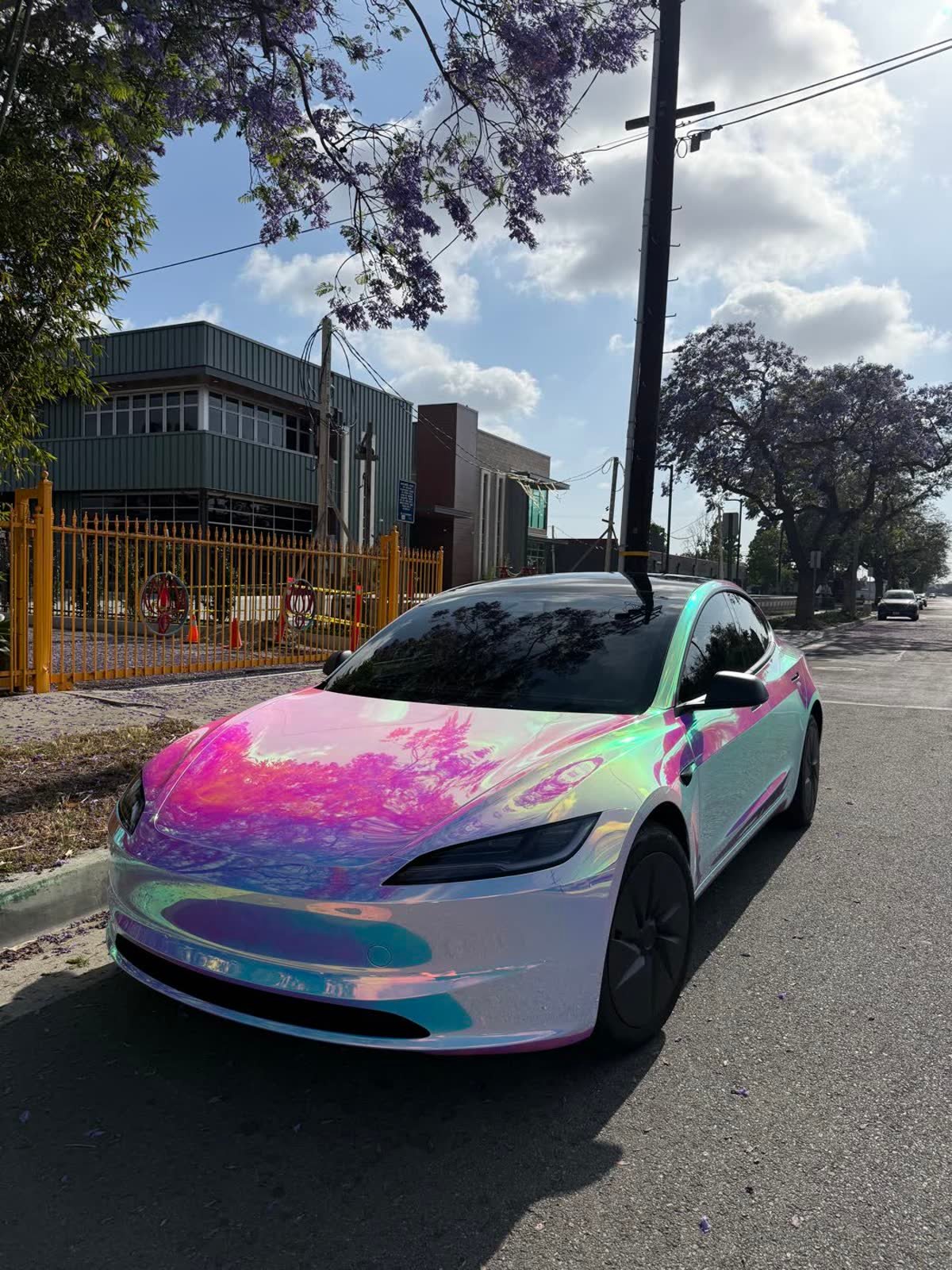Car wrapped in colour-change vinyl at the All Wraps Long Beach bay